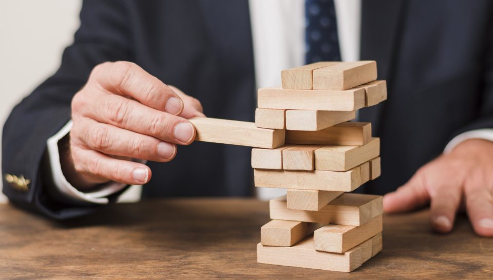 businessman-playing-jenga