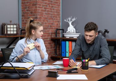 top-view-young-funny-office-team-focused-one-issue-office-enviroment